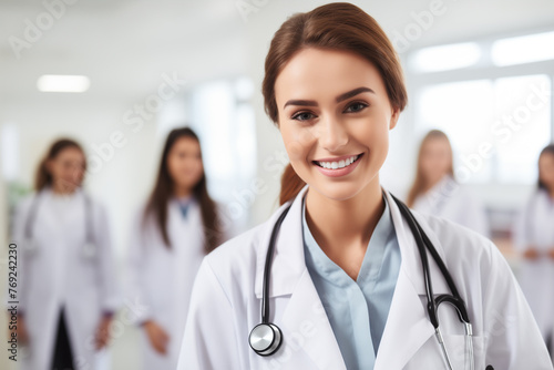 Young female doctor on modern clinic background.