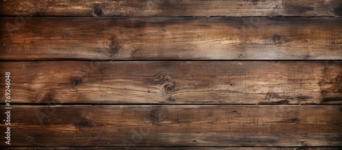A detailed shot of a Brown Hardwood Plank wall with a blurred background, showcasing the beautiful Wood grain pattern and quality of the building material