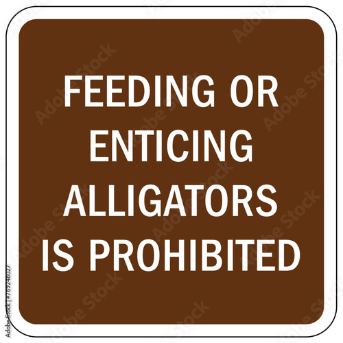 Alligator warning sign feeding or enticing alligators is prohibited