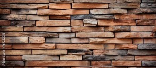 A detailed closeup of a brown brick wall showcasing various types of bricks including woodlike  hardwood  and rectangular shapes used as building material for the facade and flooring