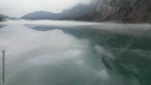 Pan shot of lake Klöntalersee in Glarus Canton, Switzerland photo