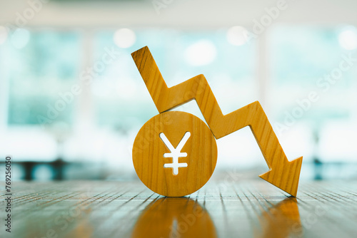 Yen symbol model and down arrow  concepts of systems of raising or lowering Fed interest rates, Japan's economy,  The problem of the depreciating yen continuously.