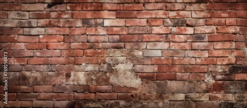 A detailed view of a brick wall showcasing the intricate patterns created by the composite material  bricks  and mortar. The texture contrasts beautifully with the surrounding wood and font