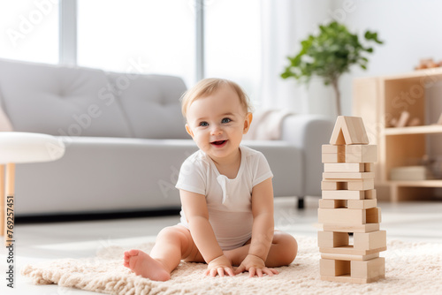 Baby playing with stacking building blocks at home while sitting on carpet in living room.