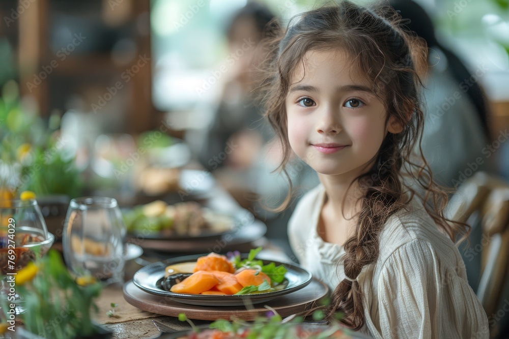A young girl with an elegant hairdo sits before a meal of salmon, looking serene A young girl with an elegant hairdo sits before a meal of salmon, looking serene