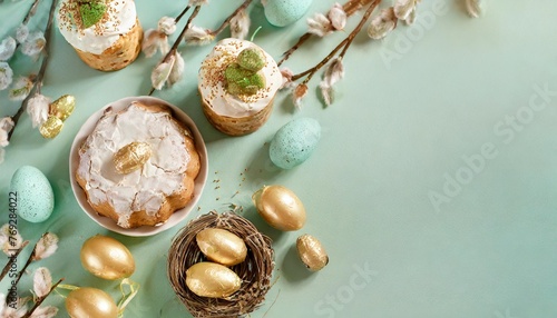 happy easter composition for easter design elegant easter eggs easter cakes and nests on mint background flat lay top view copy space