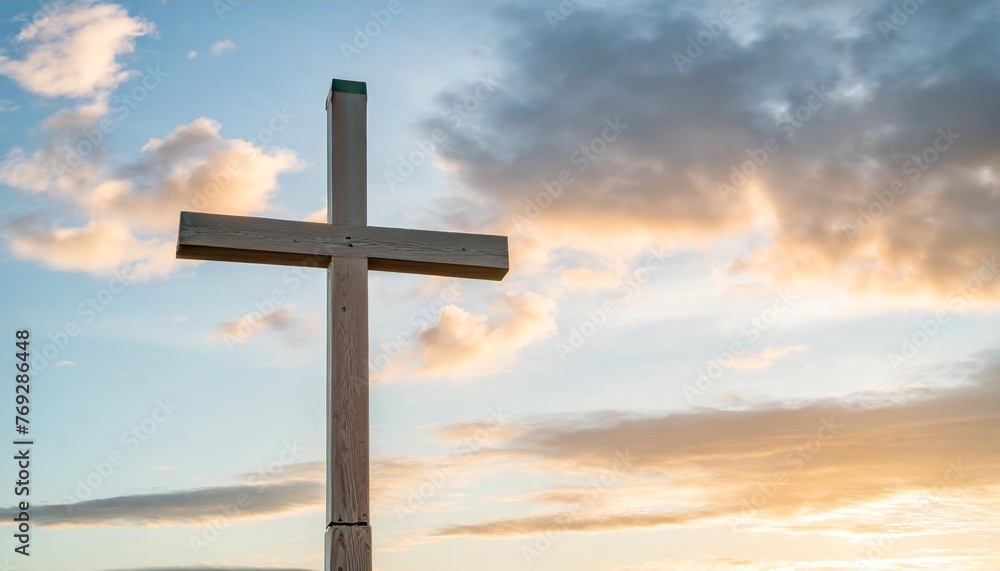 wooden cross against a serene sky symbolizing faith and renewal in the spirit of easter