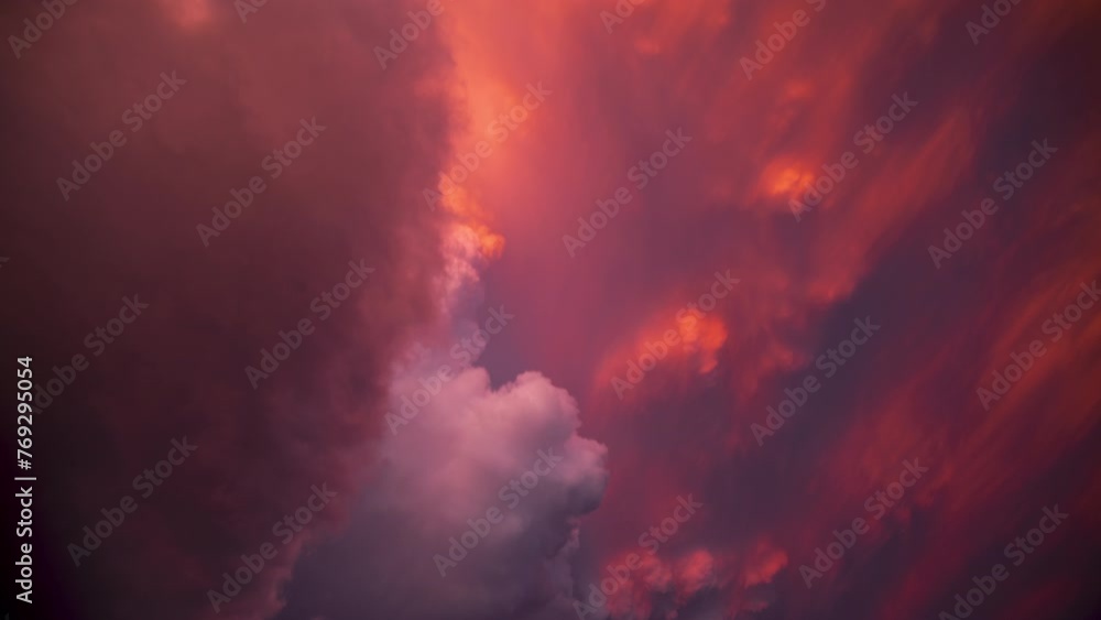Sun casts reds, pinks, and oranges as it sets below a tornado-warned supercell thunderstorm. Sun casts reds, pinks, and oranges as it sets below a tornado-warned supercell thunderstorm.