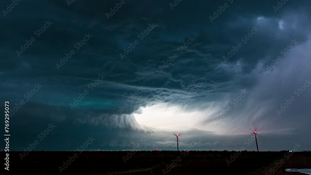 Overnight supercell thunderstorm lights up the sky with beautiful structure below. Overnight supercell thunderstorm lights up the sky with beautiful structure below.