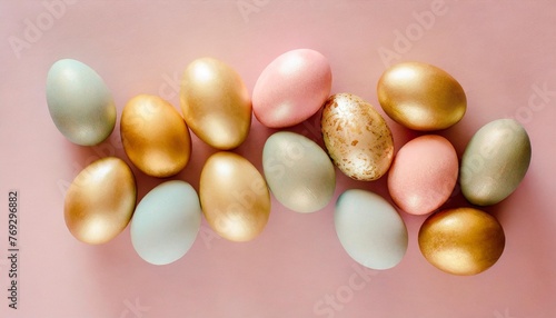 pastel easter eggs on pink background top view flat lay style
