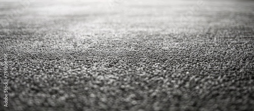 Gray carpet with finished edges.