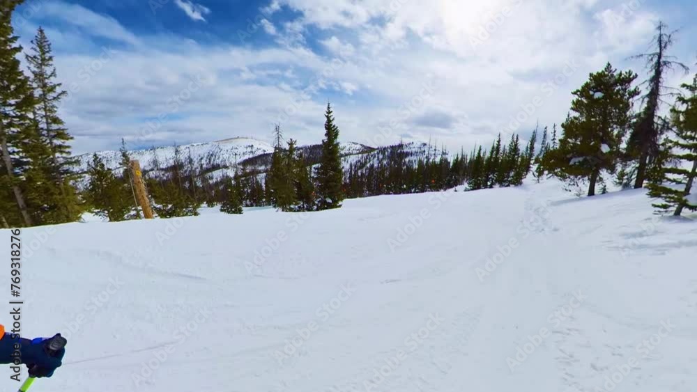 camera follows person snowboarding down mountain in Colorado camera follows person snowboarding down mountain in Colorado