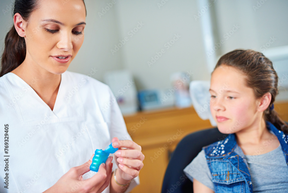 Woman, dentist and kid with floss, girl and smile in a modern office and wellness with child development. Trust, support and oral health with string or patient with dental hygiene and consultation Woman, dentist and kid with floss, girl and smile in a modern office and wellness with child development. Trust, support and oral health with string or patient with dental hygiene and consultation