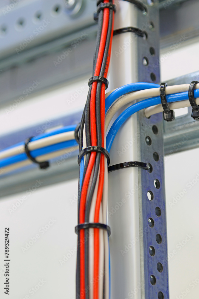 Mounting electrical wires tied with plastic ties.