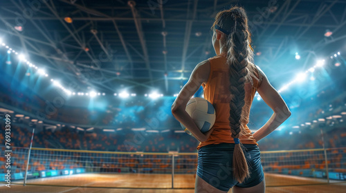 Woman volley ball player look into crowd in the stadium photo