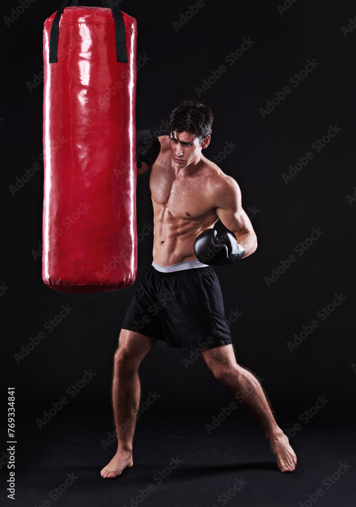 Man, gloves and boxing bag for fitness practice or cardio workout for health, fighter or black background. Male person, punch and martial arts training in studio on mockup for muscle, gym or fist Man, gloves and boxing bag for fitness practice or cardio workout for health, fighter or black background. Male person, punch and martial arts training in studio on mockup for muscle, gym or fist