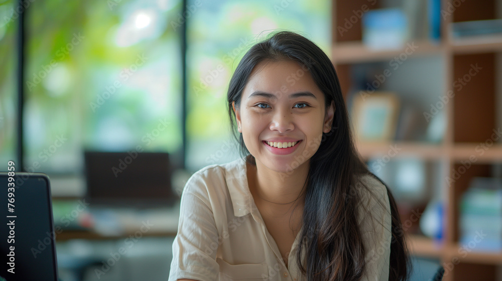 asian business woman sitting at work desk in the office with happiness asian business woman sitting at work desk in the office with happiness