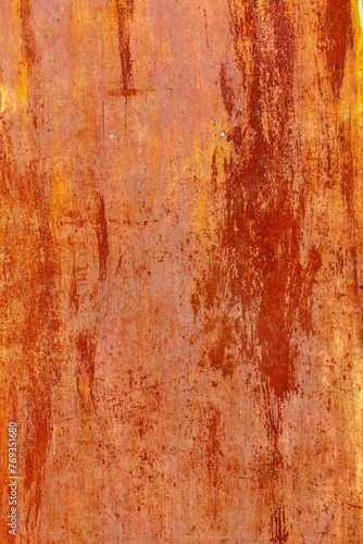 rusty red painted flat sheet metal surface with leftovers of white paint full-frame background and texture.