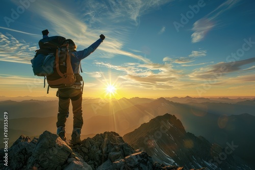 A man standing triumphantly on a mountain peak with his arms raised in victory