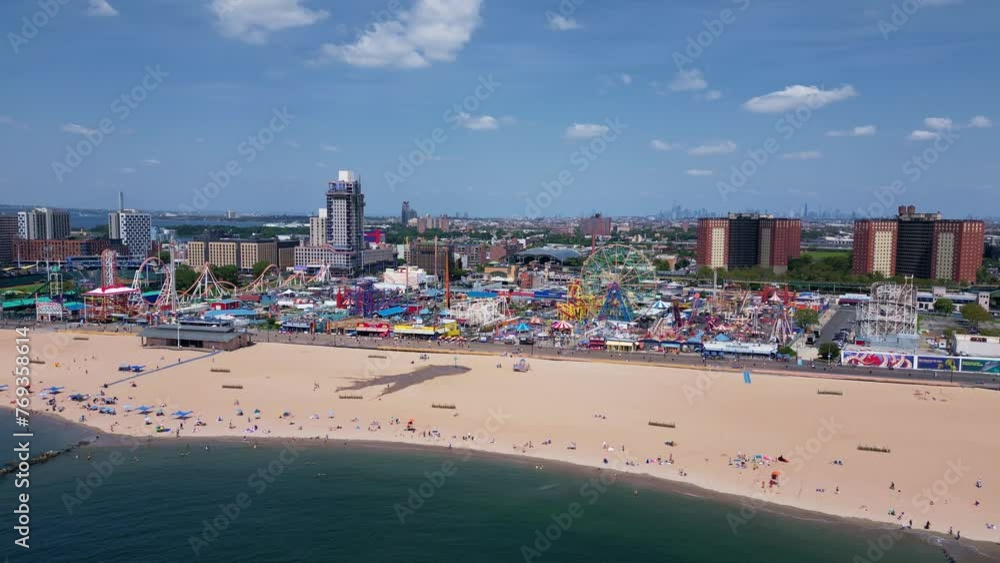 Panning right along the coast of Brighton Beach passing acres of amusement parks Panning right along the coast of Brighton Beach passing acres of amusement parks