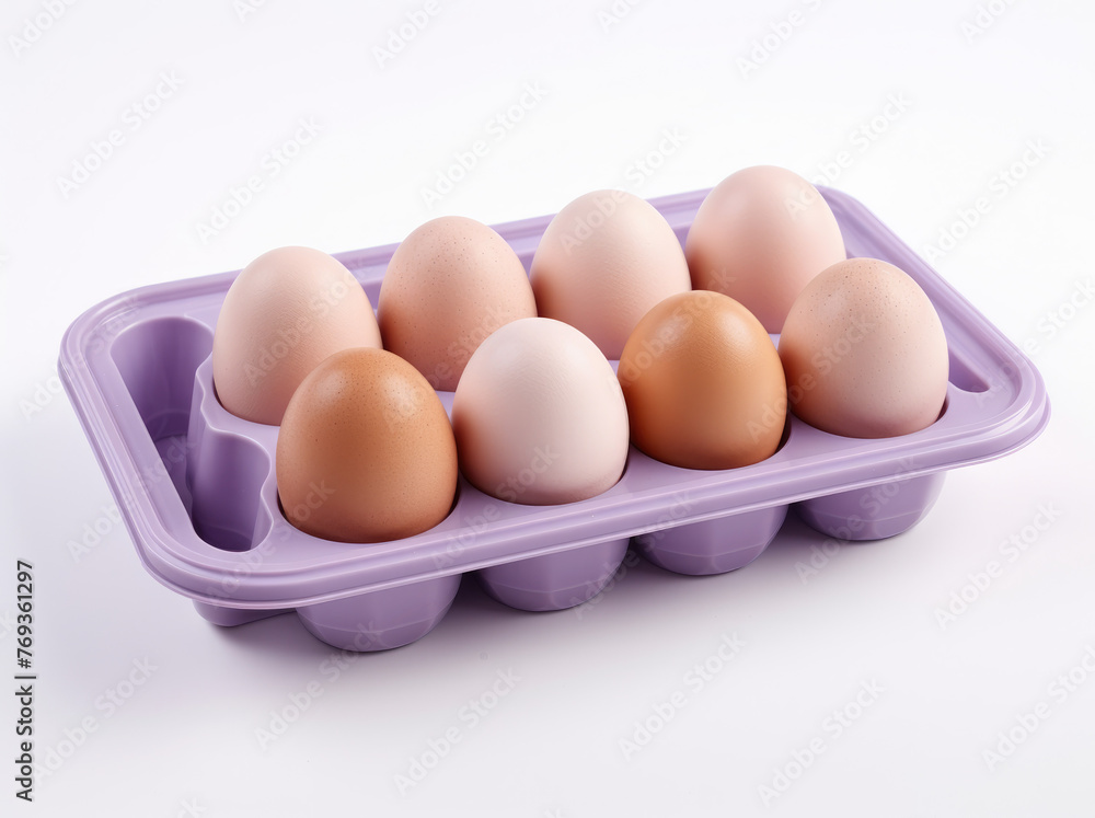 A set of plastic trays with whote and brown egg, isolated on a white background A set of plastic trays with whote and brown egg, isolated on a white background