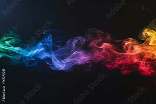 Vibrant smoke in rainbow hues creates abstract shapes against a dark background.