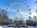 Ferris wheel attraction against a blue sky