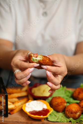 Person Holding a Piece of Food in Their Hands photo