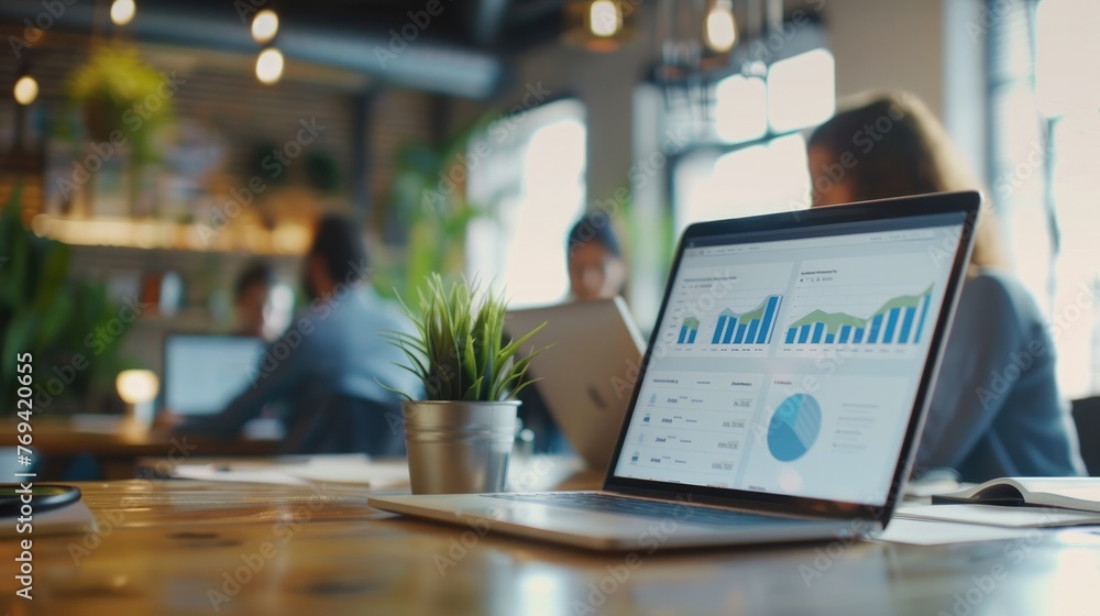 Close up of digital marketing employee using computers at coworking space.