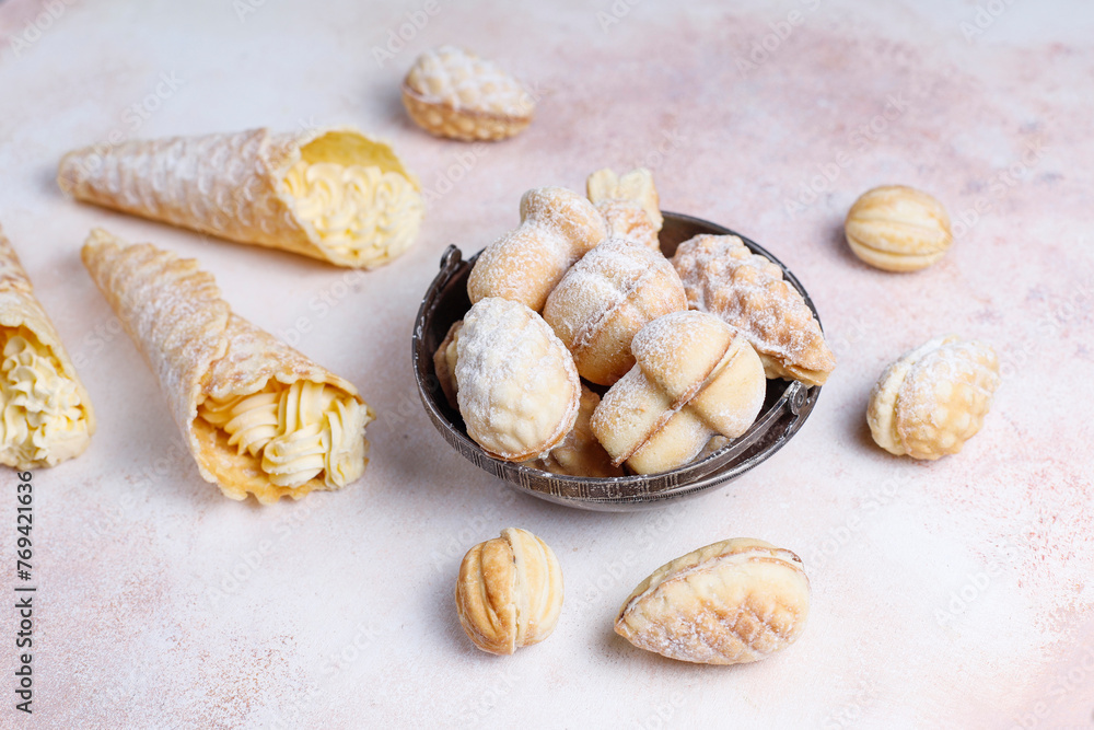 Homemade nut shaped russian soviet cookies and wafer rolls with pastry cream. Homemade nut shaped russian soviet cookies and wafer rolls with pastry cream.