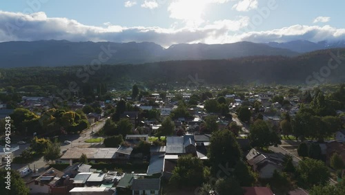 El Bolson Town With View Of Piltriquitron Mountain In Rio Negro Province, Argentina. aerial pullback shot photo