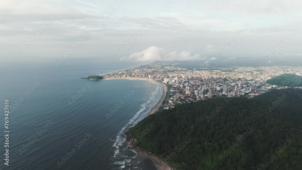 Aerial view of the sprawling city of Guaratuba, where its grandeur and size are magnificently showcased, nestled along the picturesque Paraná coast. Aerial view of the sprawling city of Guaratuba, where its grandeur and size are magnificently showcased, nestled along the picturesque Paraná coast.