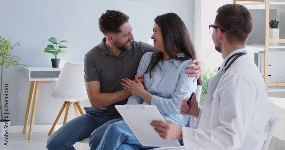 Gynecologist is consulting a family couple, planning pregnancy or IVF during a hospital visit. Couple is happy and engaged in a medical session with the doctor, seeking guidance to future parenthood. Gynecologist is consulting a family couple, planning pregnancy or IVF during a hospital visit. Couple is happy and engaged in a medical session with the doctor, seeking guidance to future parenthood.