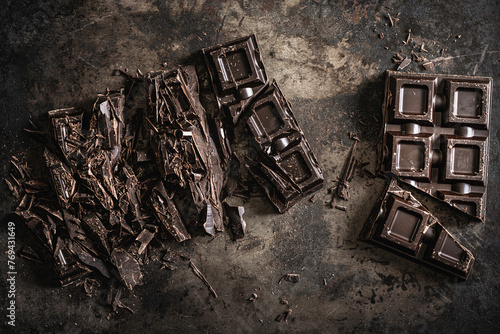 Dark Chopped Chocolate on Textured Background photo
