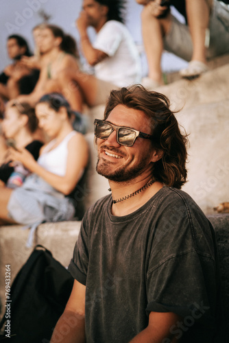 A man in sunglasses watches the sunset, Canggu, Bali.