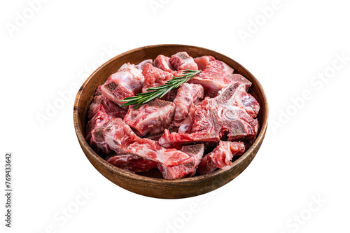 Fresh Raw meat on the bone diced for goulash in a wooden plate.  Isolated, Transparent background. © Vladimir