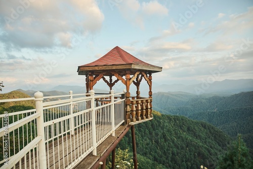 Wooden gazebo in a mountainous area. To explore the natural landscape. Tourism and travel