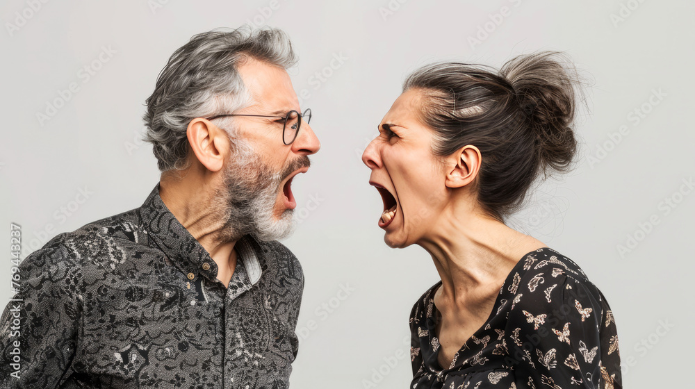 Man and woman engaged in a heated argument, depicting conflict and intense emotional exchange Man and woman engaged in a heated argument, depicting conflict and intense emotional exchange