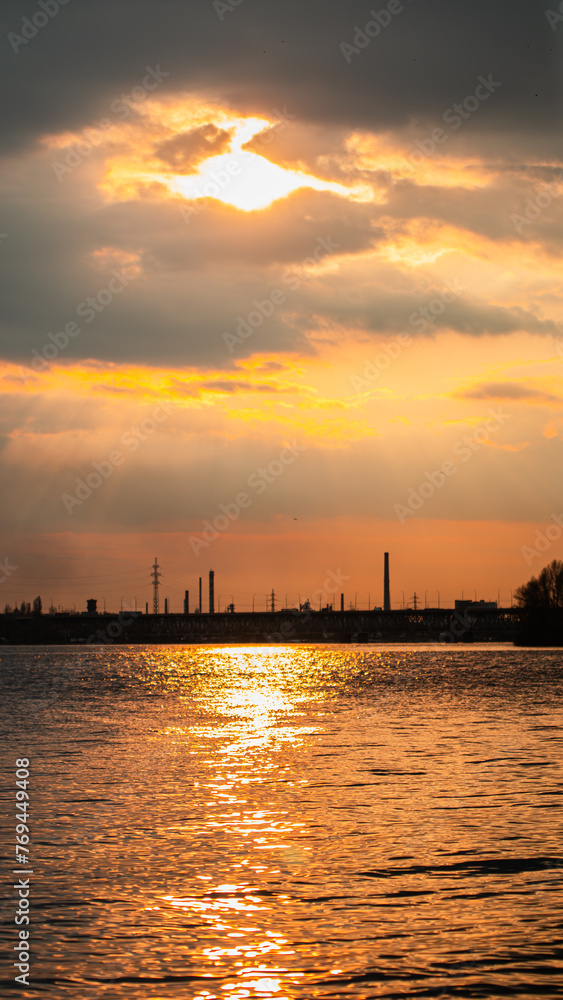 View of the Dnieper city during a beautiful sunset or sunrise. Warm days in the city. Interesting view. Ukrainian city in 2024. Beautiful sky.