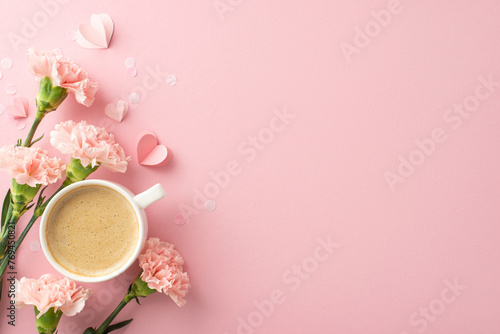 Modern Mother's Day concept. Top view perspective of silky flat white, perky carnations, wee hearts, and confetti on a flamingo pink base, space allocated for text or commercials photo