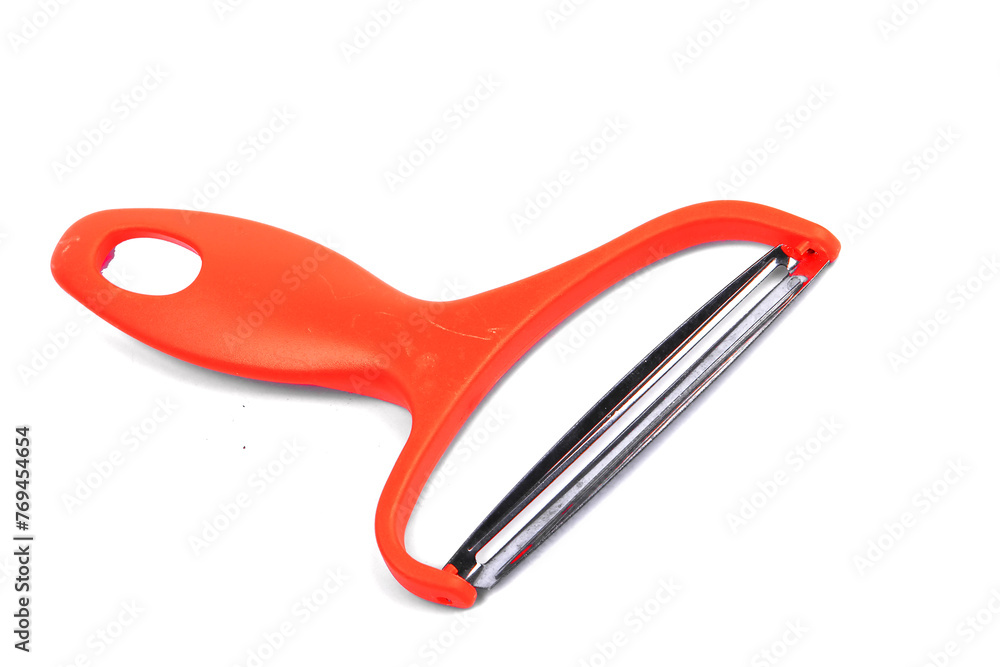 Slicing potatoes. Potato peeler. on a white isolated background. Slicer. Professional vegetable peeler for chefs with a sharp knife or stainless steel blade. Kitchen utensils for the kitchen.. Slicing potatoes. Potato peeler. on a white isolated background. Slicer. Professional vegetable peeler for chefs with a sharp knife or stainless steel blade. Kitchen utensils for the kitchen..