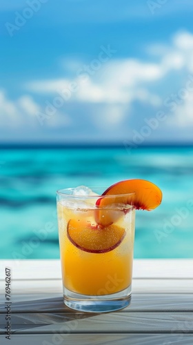 A refreshing peach cocktail garnished with fruit, served against the stunning backdrop of a calm blue sea, background, wallpaper. Summer relax mood, vacation.