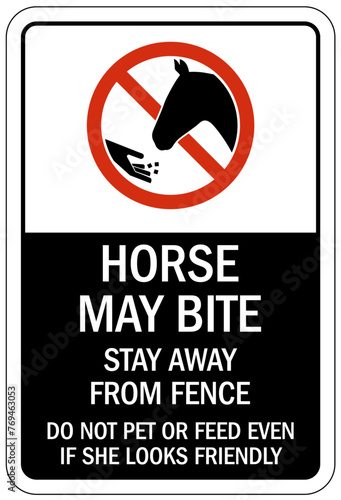Do not feed the horses sign horse may bite. Stay away from fence