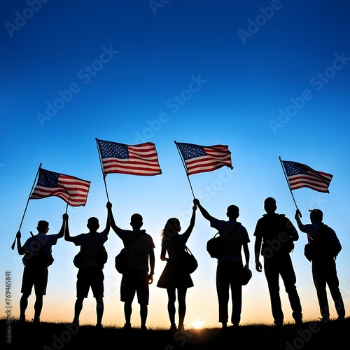 Silhouettes of people holding the USA flag celebrating the nation's independence day