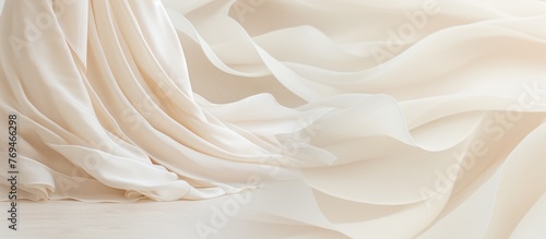 A white cloth billowing in the wind, resembling the light and airy texture of whipped cream or buttercream used in delectable desserts