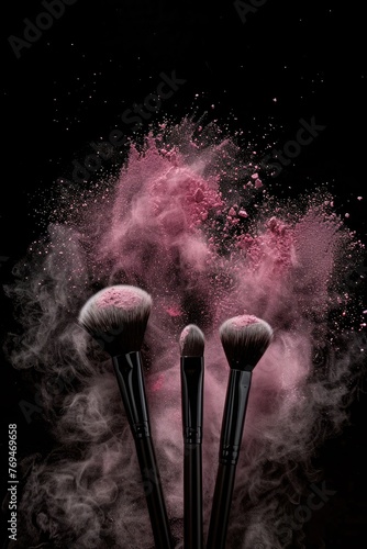 Makeup brushes and pink powder on black background. Copy space.