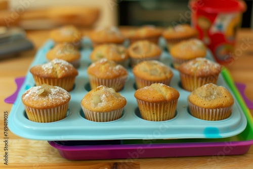 freshly baked muffins cooling in a colorful silicone tray