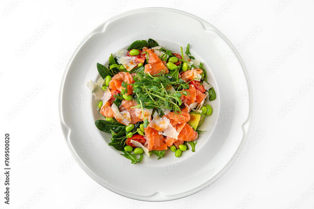 Vegetarian salad of salmon, avocado, green beans on a white plate. Banquet festive dishes. Gourmet restaurant menu. White background. Vegetarian salad of salmon, avocado, green beans on a white plate. Banquet festive dishes. Gourmet restaurant menu. White background.
