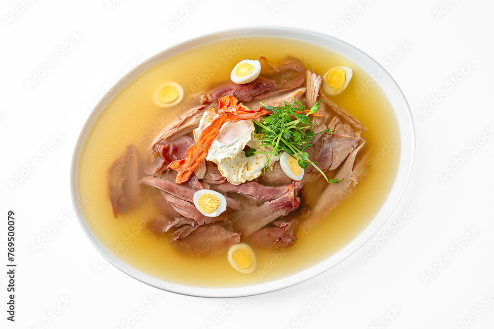 Chicken cholodets. Zalivnoe, a traditional Russian dishon in a white plate. Banquet festive dishes. Gourmet restaurant menu. White background. Chicken cholodets. Zalivnoe, a traditional Russian dishon in a white plate. Banquet festive dishes. Gourmet restaurant menu. White background.