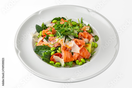 Vegetarian salad of salmon, avocado, green beans on a white plate. Banquet festive dishes. Gourmet restaurant menu. White background.